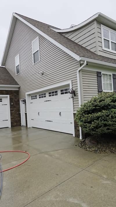Clean driveway and garage after washing